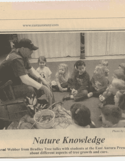 ceo of bradley tree and landscaping, jared webber, sitting down with and educating kids on buffalo tree care and growth